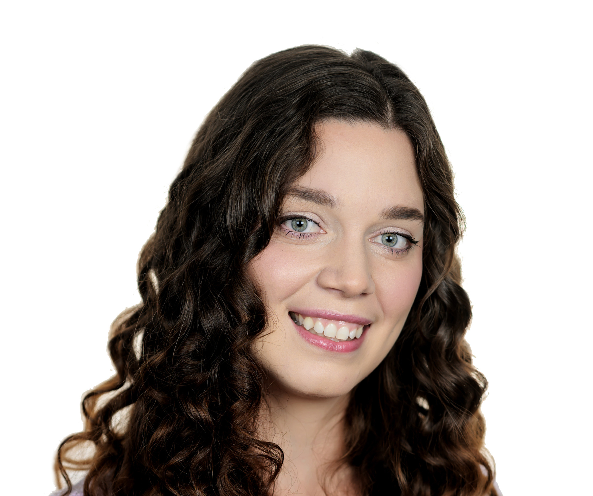 Portrait of a smiling woman with long, dark curly hair wearing a lavender sweater, against a white background